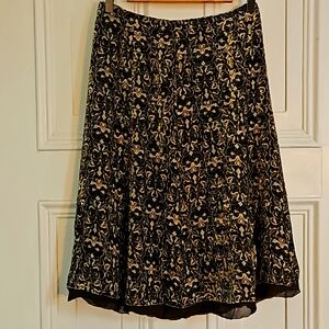 This is a beautiful and Taylor skirt size 2    the fabric is a lush velvet feel